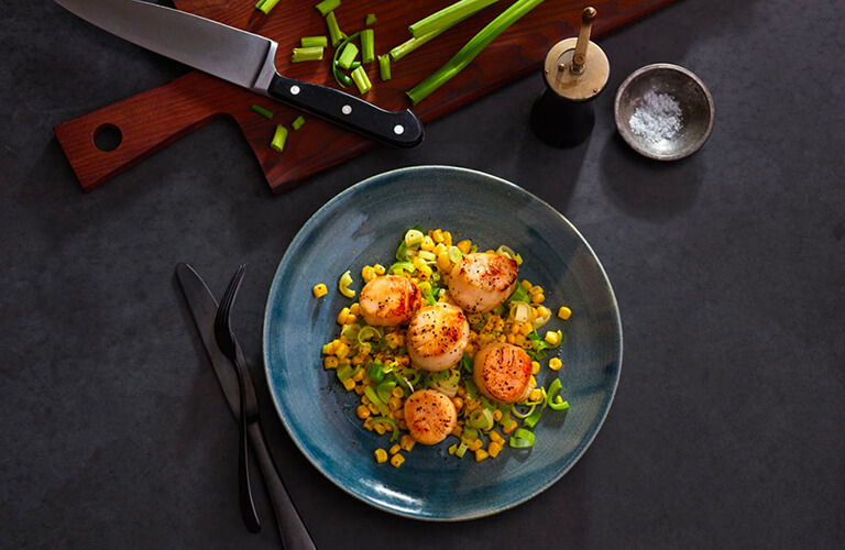 Seared scallops in olive oil with braised leeks