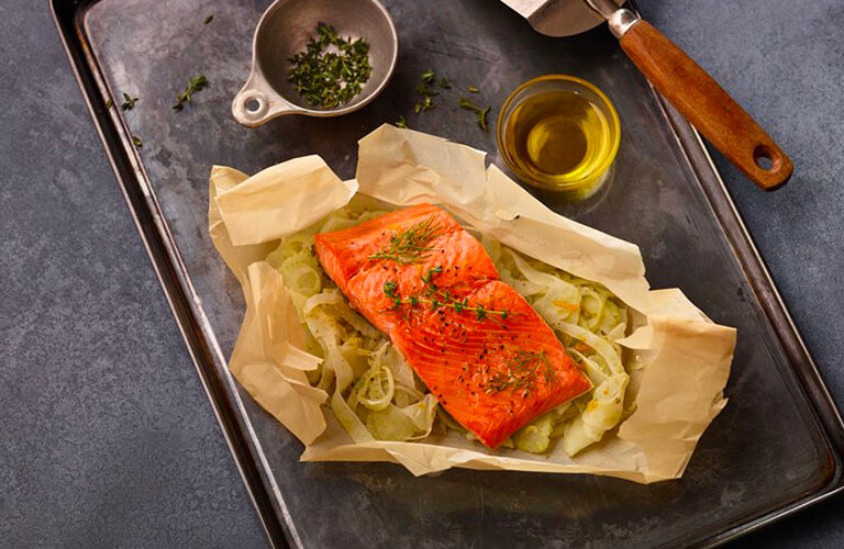 Herbed salmon and fennel en papillote with olive oil drizzle